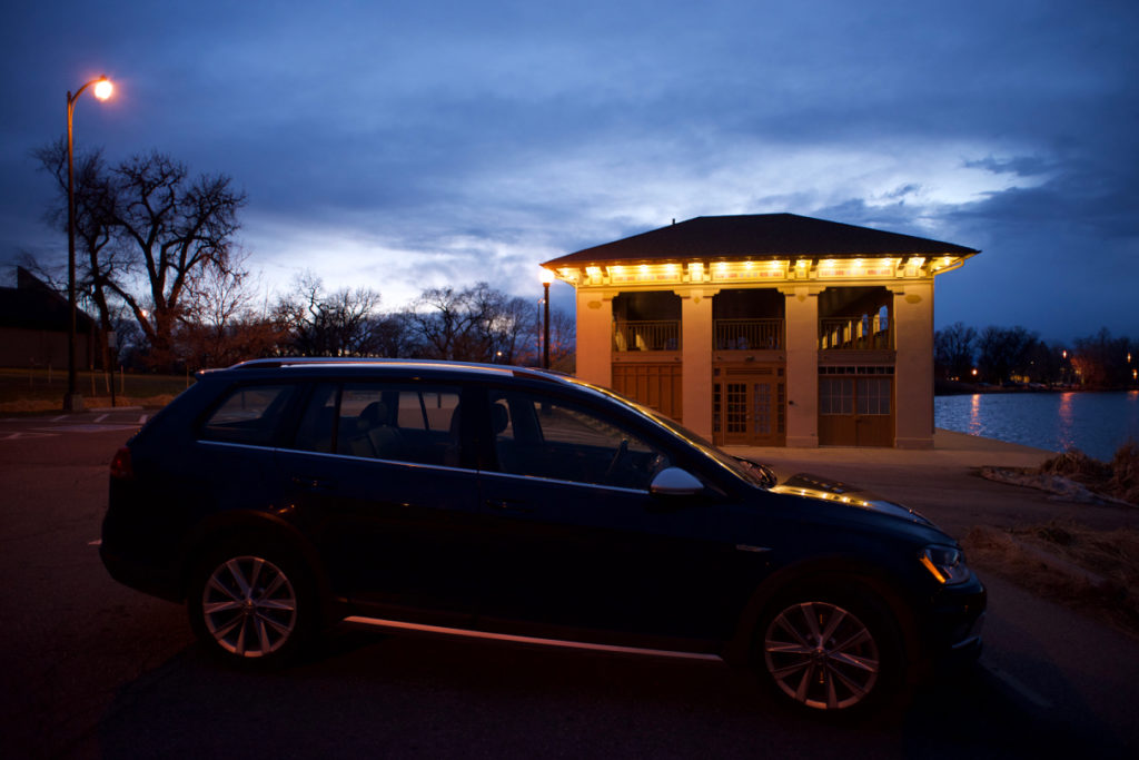 2017 Golf Alltrack at a lake at Washington Park Boathouse in Denver, Colorado, night time, blue sky, blue hour.