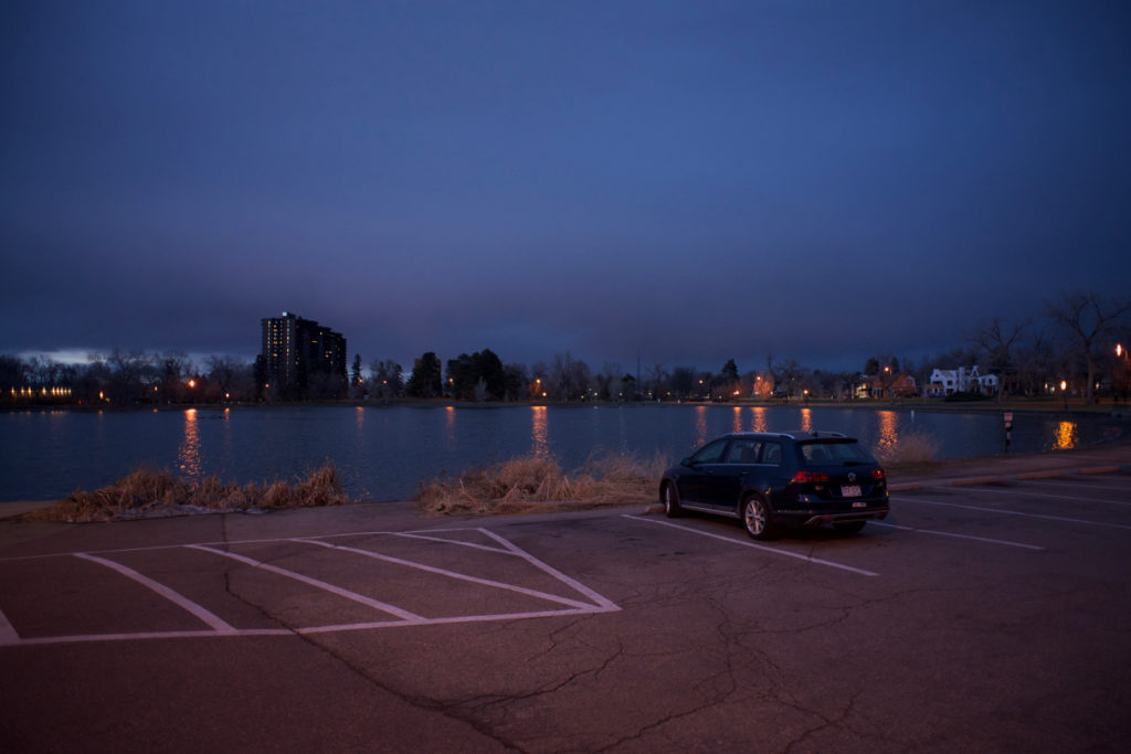 2017 Golf Alltrack at a lake at Washington Park parking lot in Denver, Colorado, night time, blue sky, blue hour.